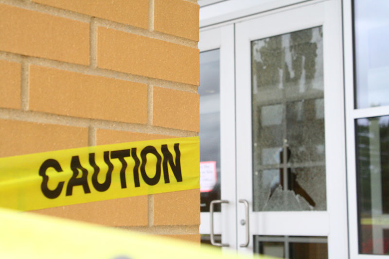 Student breaks window on door to varsity gym
