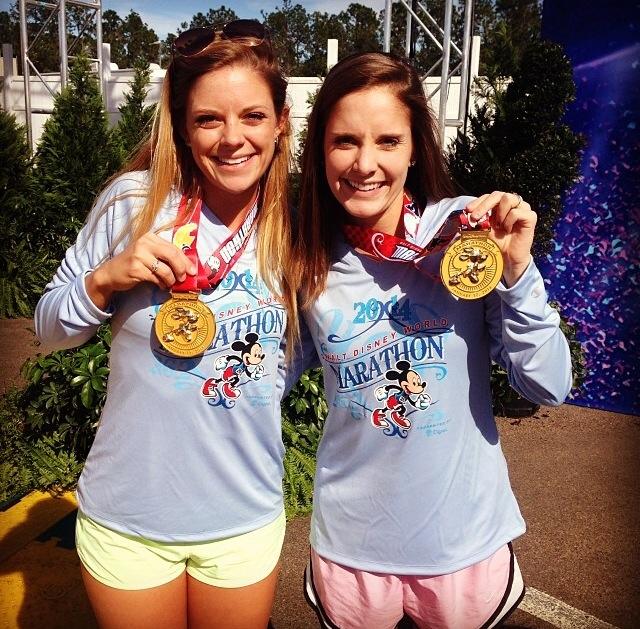 Annie Cockerline (left) and her sister Alyssa Cockerline (right) pose with their medals after completing the Walt Disney World Marathon 