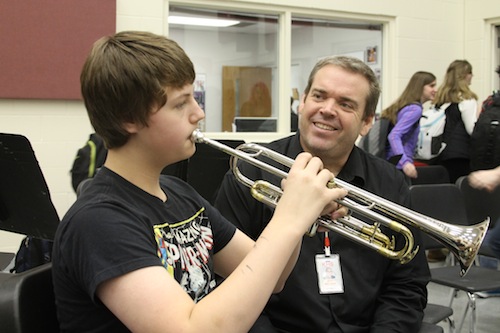 Band Director, Jeff Melsha, assists a trumpet player during class. Melsha directs the Concert band and WInd Ensemble at KHS.