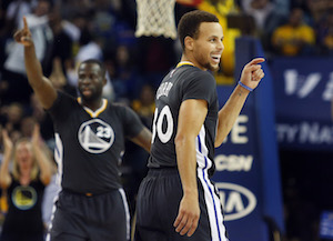 The Golden State Warriors Stephen Curry (30) reacts after a 3-point basket, tying his fathers Dale Currys 3-pointer mark, against the Brooklyn Nets in the first half at Oracle Arena in Oakland, Calif., on Saturday, Nov. 14, 2015. (Ray Chavez/Bay Area News Group/TNS)