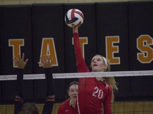 Kara Steele, senior, sets the ball to the Webster girls varsity volleyball team.