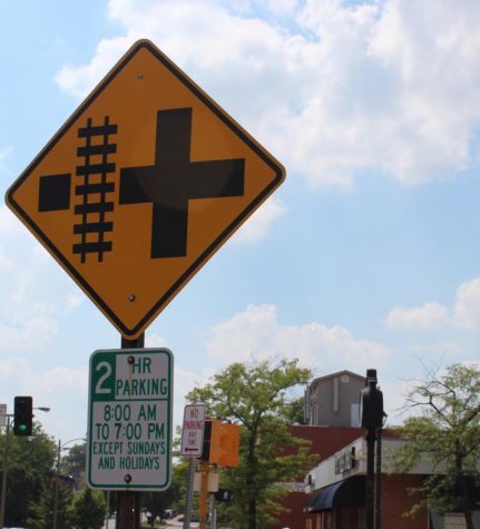 Picture of a railroad crossing sign in downtown Kirkwood.