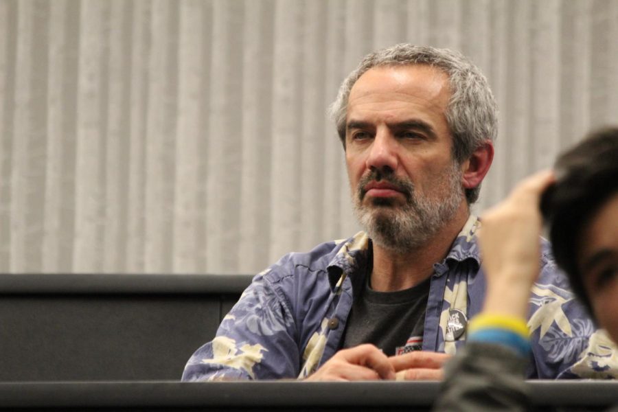 Bob Becker, chemistry teacher, listens to Dana Veasman talk about sexual assault.  