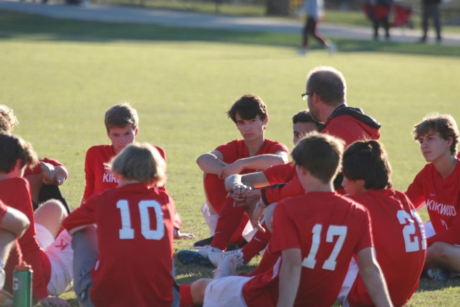 The team gathers during halftime for a pep talk from Coach Fisch.