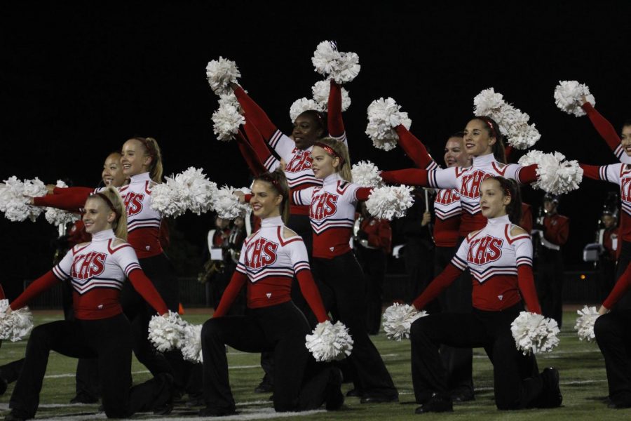 Kirkwood varsity pommies strike their final pose at the end of their halftime performance.