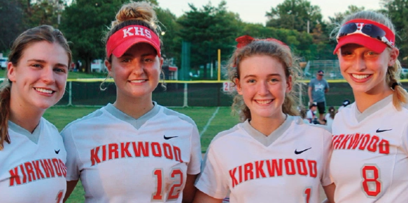 Softball captains Lindsay McCarthy, Devin Tomlin, Kasey Ginder and Kate Hastings