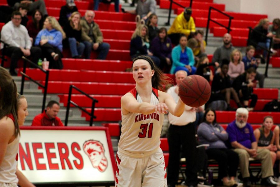 Abby Ludbrook, senior, passes the ball to her teammate.