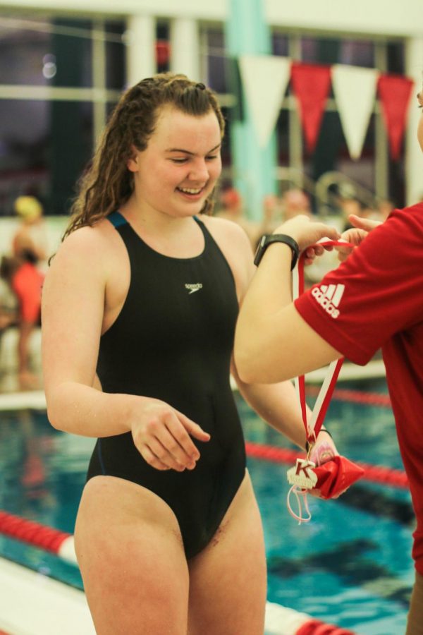 Julie Obertop, sophomore, places third in the 100 breaststroke. 