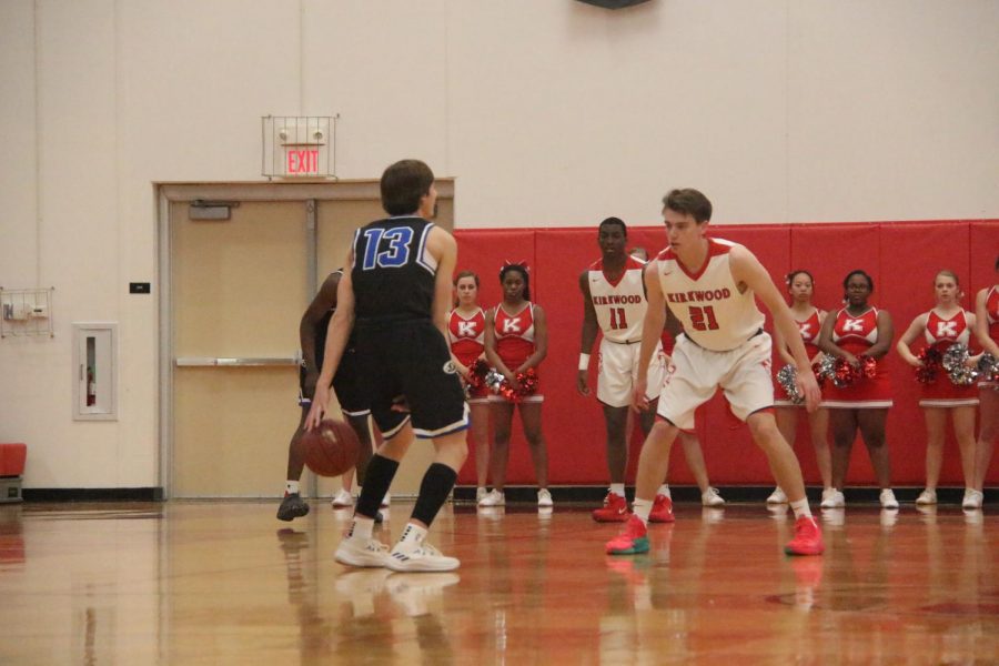 Jonah McDowell, senior, guards a Ladue player.