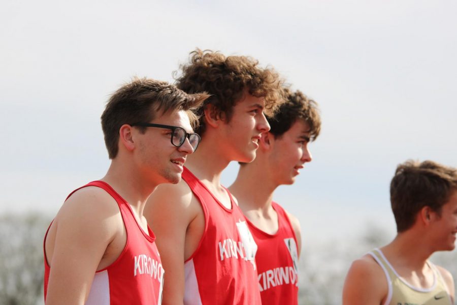 John Engelmohr and Henry Ebert, juniors, and Teddy Ceresia, senior, stand at the starting line as they wait to start the 1600. 