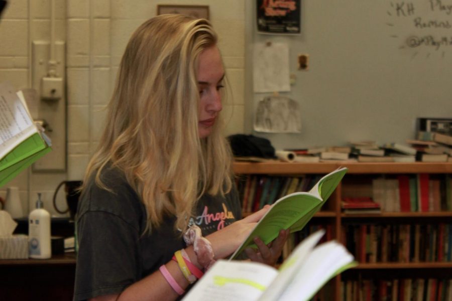 Jess Cohen, junior, studies her script during rehearsal for Blood at the Root.