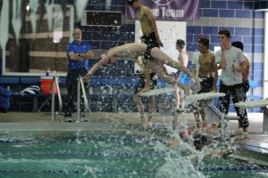 Kirkwood Swimmer dives to catch his team up in a relay race. 
