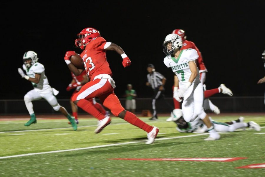 Senior wide receiver Melvin Simmons (23) beats Marquettes defense to score a 43-yard touchdown to give KHS a 14-7 lead late in the first half. Photo by Natalie Sweesy/Pioneer Yearbook. 
