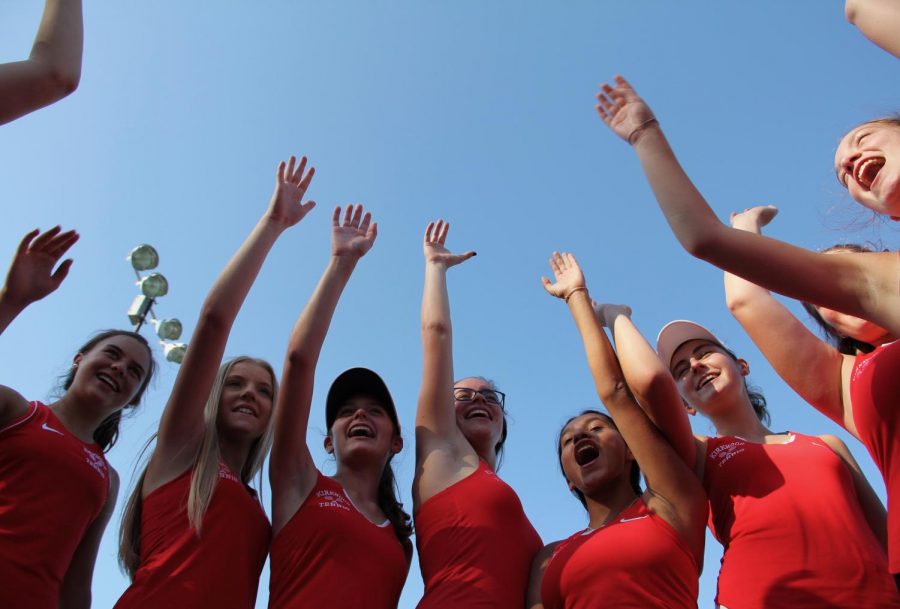 The KHS girls JV tennis team says their cheer before their match.