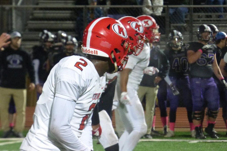 Jairus Maclin, senior, looks across the field at his teammates. 