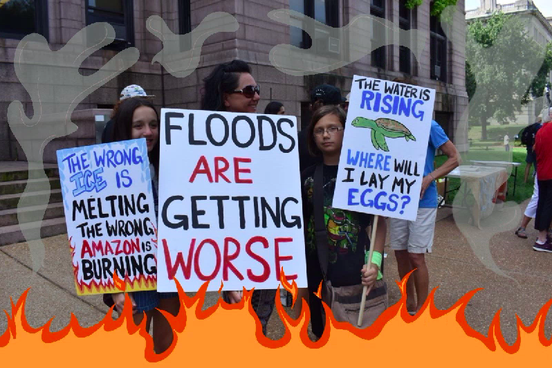 A family stands outside of the STL city hall at the climate strike. 