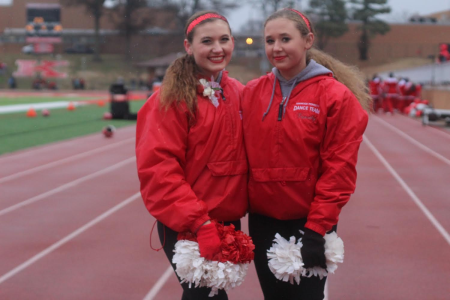 Isabella Knopfel, sophomore, and Olivia Knopfel, senior, pose after the Turkey Day game. 