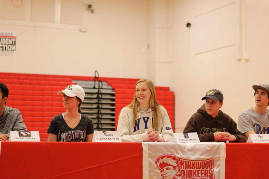 Natalie Bruns, senior, smiles as she is introduced during the ceremony. Bruns  is committed to play basketball at New York University in the fall.