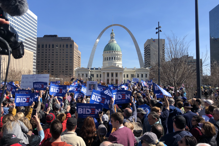 2020 presidential candidate Joe Biden speaks to the crowd of spectators waving campaign signs. 