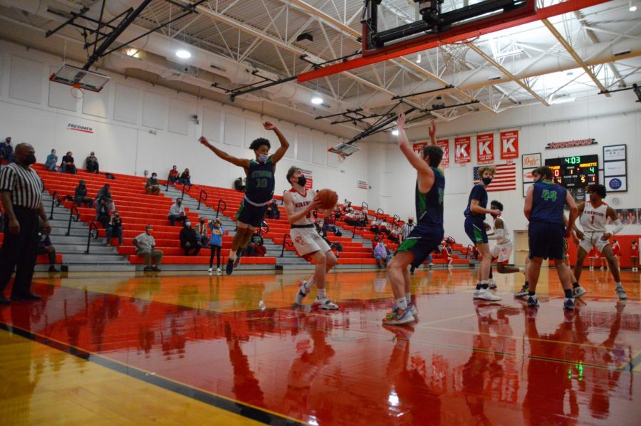 Christian Hughes goes up for a shot in the boys varsity basketball game against Marquette.