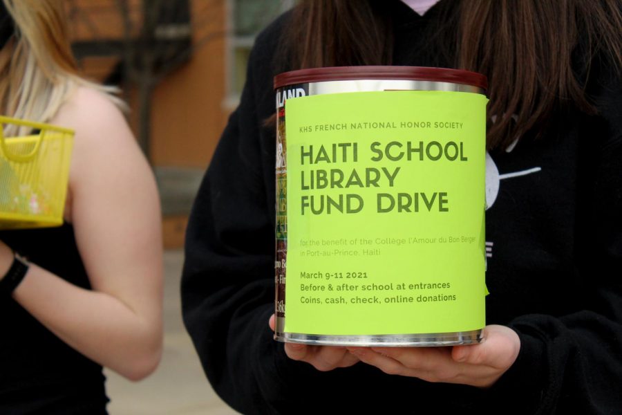 The Haiti fundraiser is collected through metal tins every morning and afternoon.