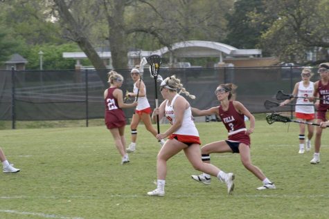 Sydney Shields, sophomore, cradles the ball down to the goal. 