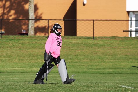 Ellie Hubbard, sophomore varsity goalie, heads to the goal to set up.