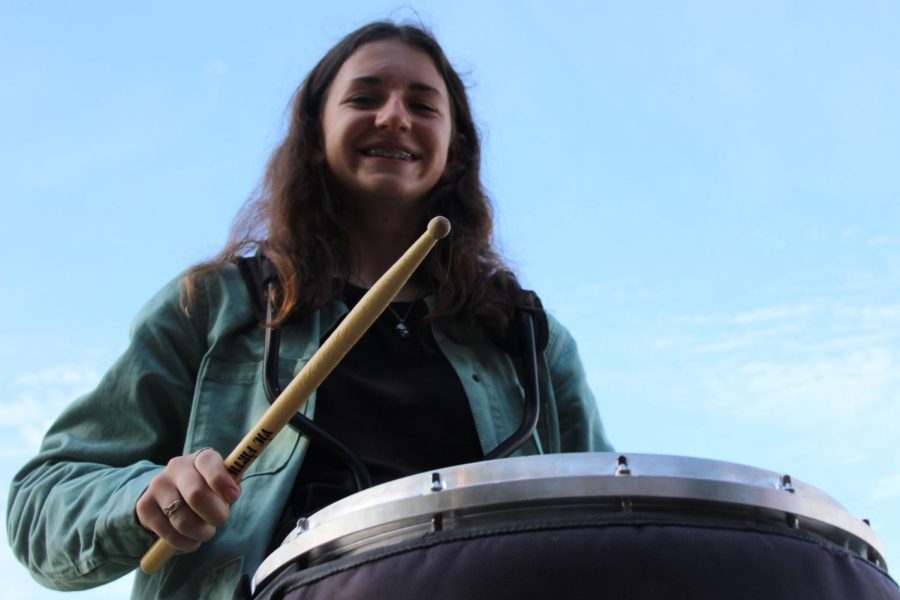Lily Mitchell, leader of the drumline, plays her snare drum in preparation for Friday night lights.