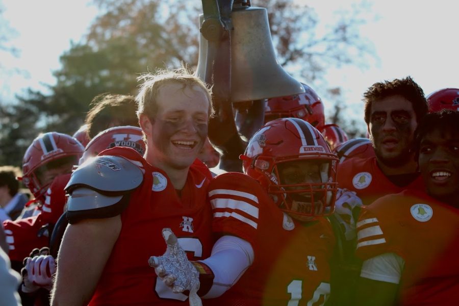 The Kirkwood team carries the bell away after winning the Turkey Day game. 