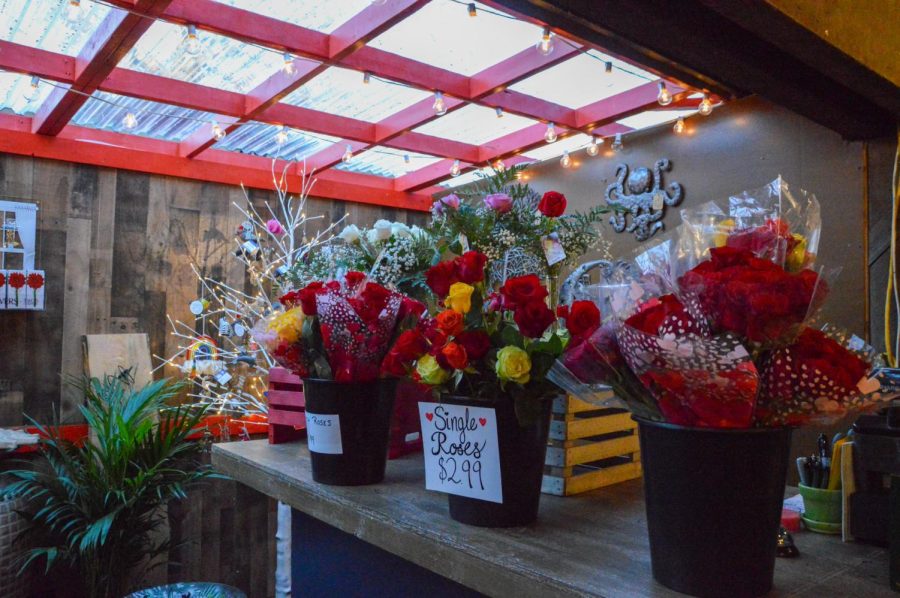 Buckets of various roses for Valentines Day are for sale at the Kirkwood Farmers Market.