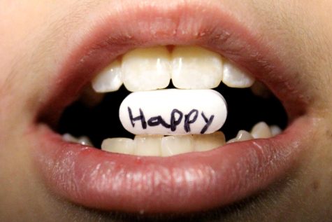 This picture shows how the intake of drugs may be use because they make people seem more happy.