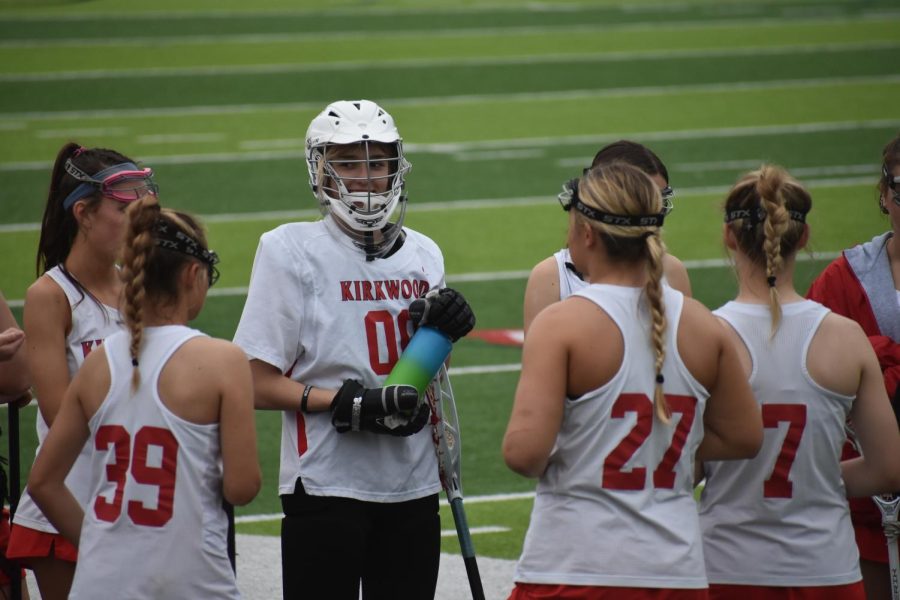 A group of varsity girls bond at one of their final lacrosse games.