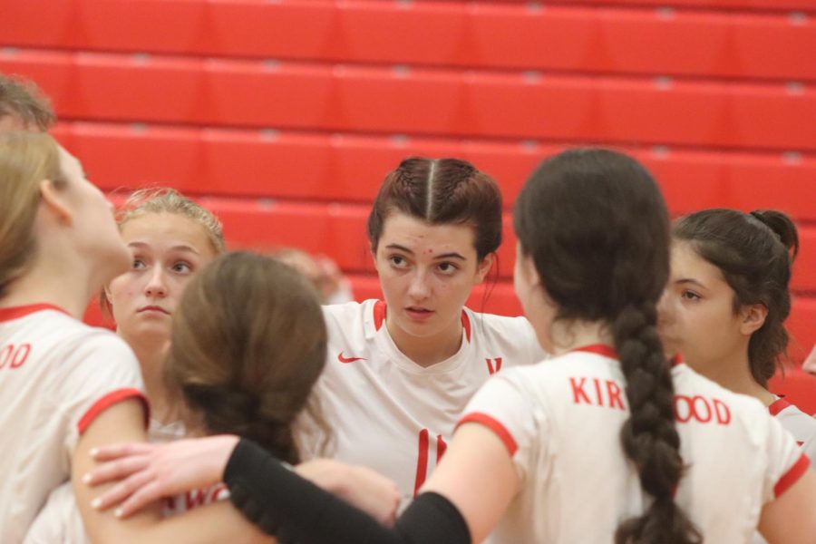 Norah Manwaring, sophomore, listens to coach Pounds during a timeout.