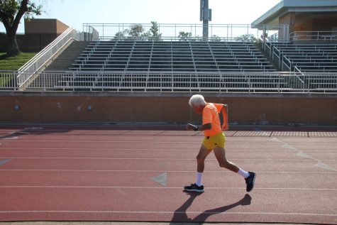 Pat Britt runs a lap around the Kirkwood High School Track on a Thursday morning. Sep. 10th, 2022.