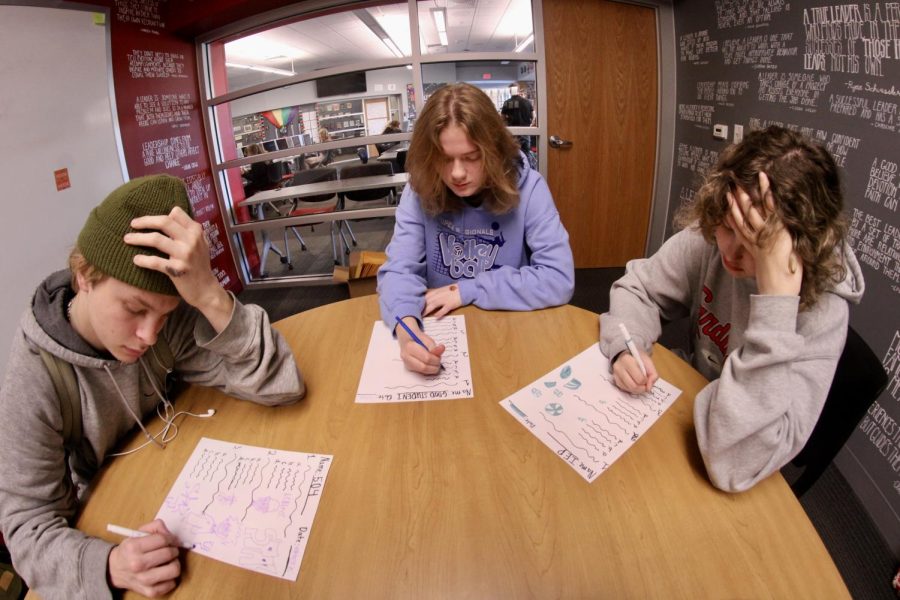 Students Ryder George-Lander, Annalise Bancks, and Gray Campbell struggle with a test. 