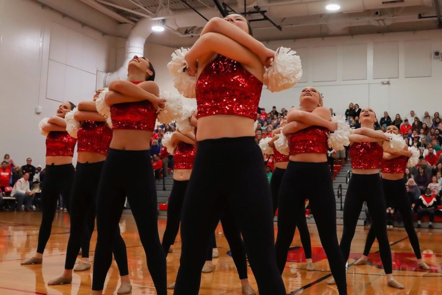 The Kirkwood Varsity Poms team strikes a final pose at the end of their pep rally dance.