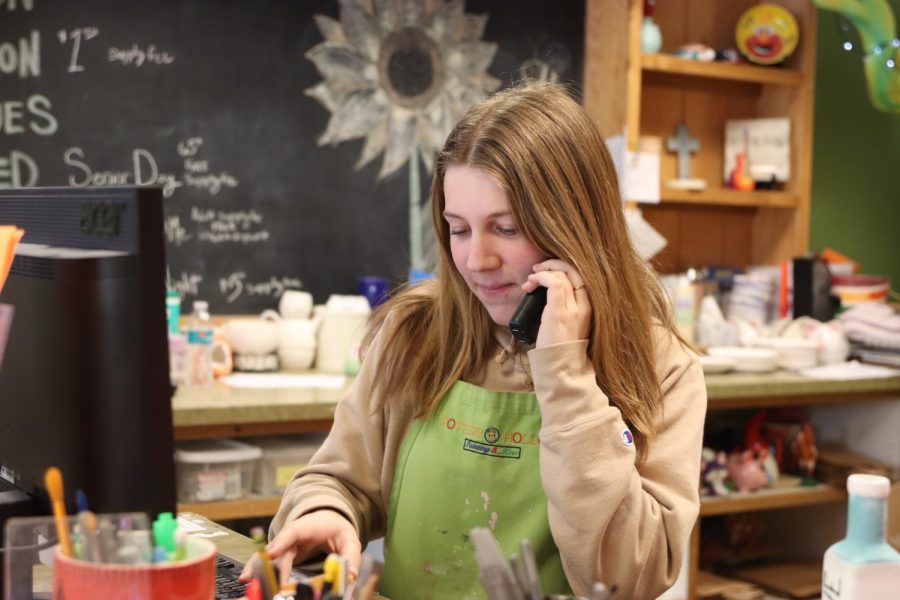 Anna Larkin has worked at Pottery Hollow for four months, spending her Friday nights and weekends helping with birthday parties and cleaning paint brushes. 
