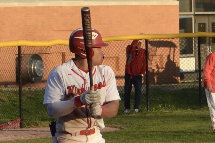 Macon stares down the pitcher while getting ready for his next at-bat.