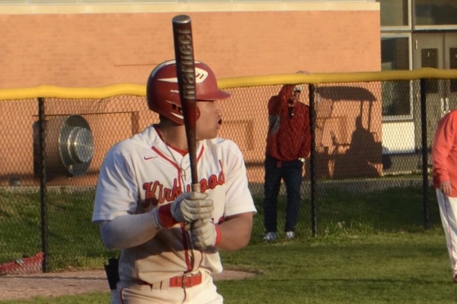 Macon+stares+down+the+pitcher+while+getting+ready+for+his+next+at-bat.