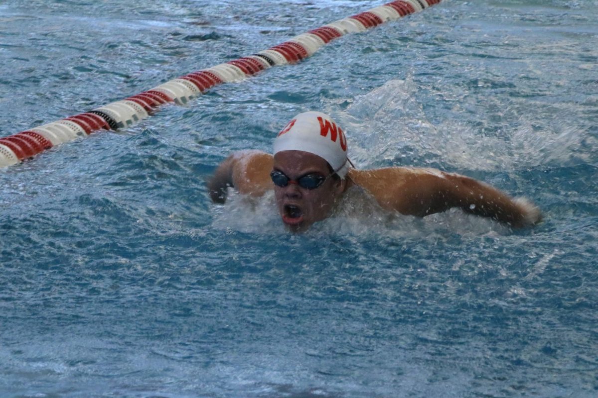 Carter Ullery, sophomore competes in the 100 butterfly.