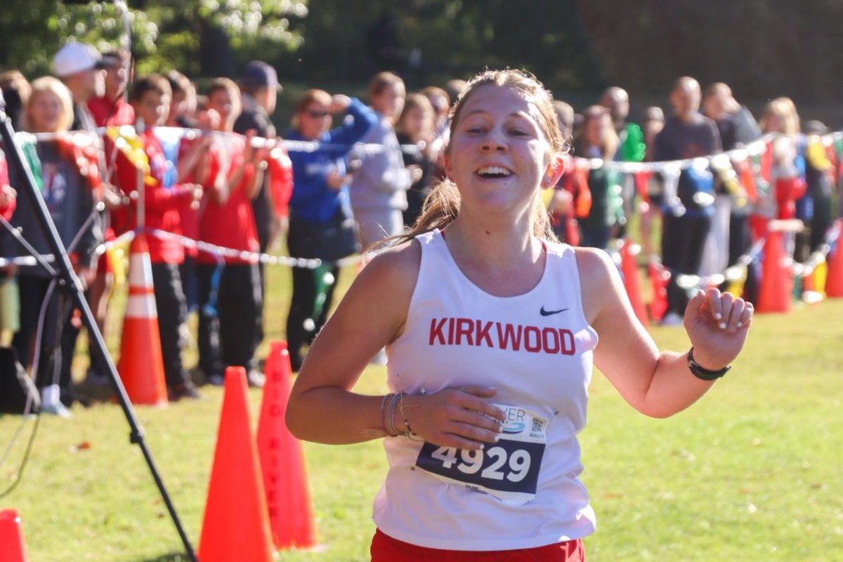 Anna Larkin, senior, lets out a sigh of relief after crossing the finish line.