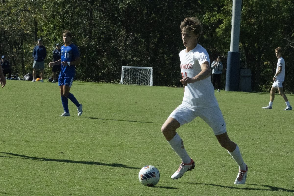 Atticus McDowell, senior, dribbles the ball down the field versus John Burroughs on Saturday Oct. 7.