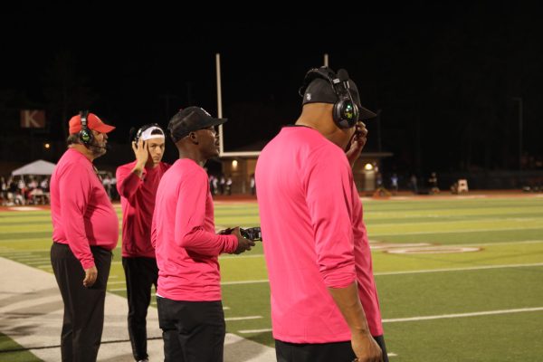 Football coaches stand on the sidelines of the Kirkwood v. Ladue Horton Watkins game on Oct. 17