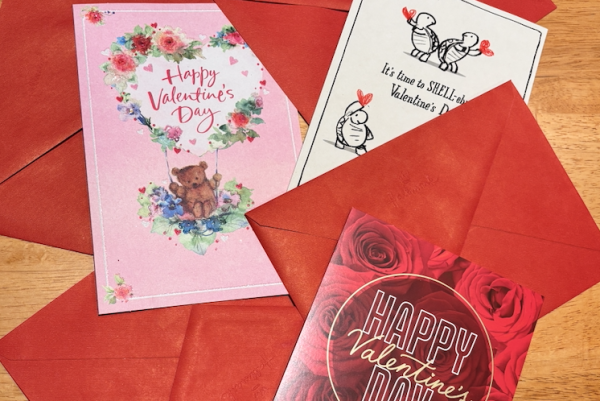 Valentine's Day cards laid out on the floor.